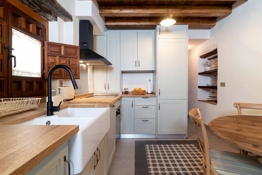 Bright kitchen and dining room interior in contemporary rustic apartment