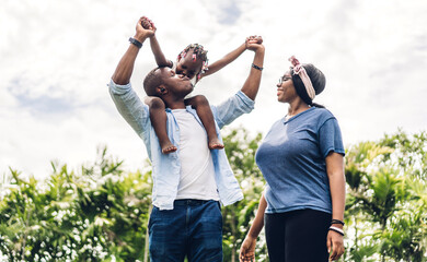 Portrait of enjoy happy love black family. play, having fun, daughter, parenthood, care, african american father and mother with little african girl child smiling moments good time at home