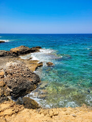 Fototapeta na wymiar Dangerous and beautiful rocky shore of the Mediterranean Sea