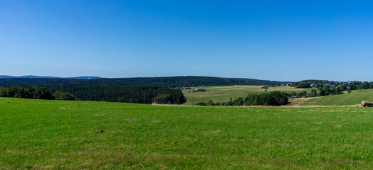 Obraz premium panorama landscape Thuringian Forest with meadow and blue sky