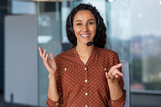 Web Camera View, Female Worker With Headset Phone Talking Consults Clients Remotely, Business Woman Looking At Camera Smiling