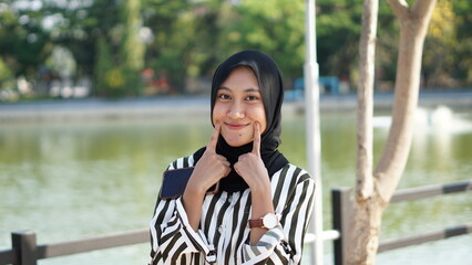 Fototapeta premium Portrait Muslim Woman. Beautiful Young Teenager in Hijab.