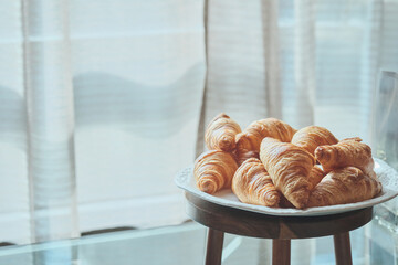 many croissants in a tray awaited to be served to the business conference attendees during the...