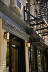 Fototapeta premium building with large windows and lanterns on cozy street in downtown of new york, urban architecture