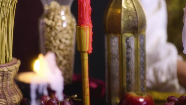 Moody Gothic Vibes: Red Candle and Lantern Illuminating the Table