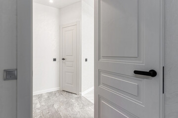 White modern interior in a new apartment, white interior doors