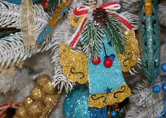 Cute decorations on the Christmas tree close-up.