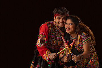 Portrait of a gujarati couple  dressed in a traditional Gujrati Attire, During the festival of...