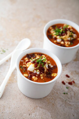 Cold tomato soup with ham and egg