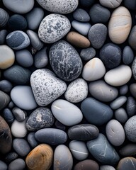 gray stone pebbles edge to edge background.