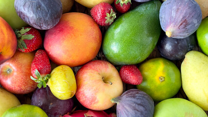 Fruit food background. Mixed fresh fruits in bulk. Top view