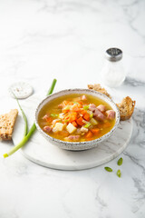 Traditional pea soup with ham and vegetables