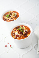 Cold tomato soup with ham and egg