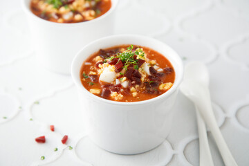 Cold tomato soup with ham and egg