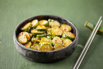 Korean Spicy Cucumber Salad with chili peppers and sesame seeds