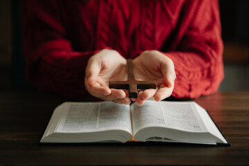 Woman praying on holy bible in the morning.Woman hand with Bible praying. Christian life crisis prayer to god...