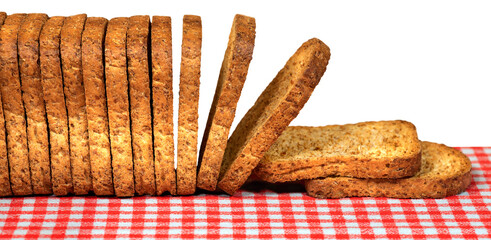 Close-up of a row of a group of rusks above a table with a red and white checkered tablecloth, isolated on white or transparent background. Png.