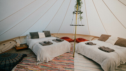bed in a luxury tent