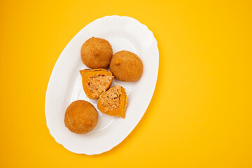 traditional fried coxinha on a plate