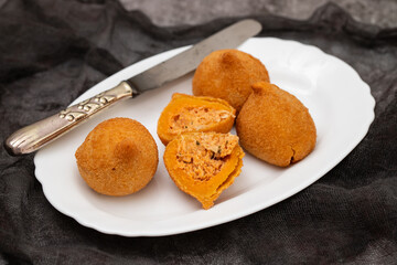 traditional fried coxinha on a plate