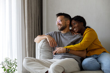 Lovely multiracial couple at home 
