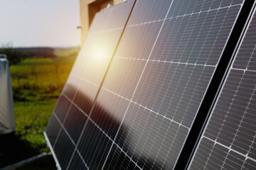 Solar panels on a well-exposed wall of an individual house, making savings following the energy...