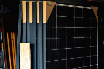 Solar panels on a well-exposed wall of an individual house, making savings following the energy...