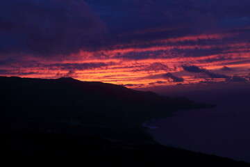 sunset on the coast of an island