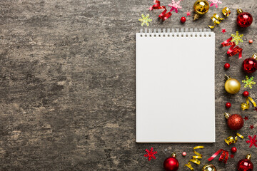 Christmas blank greeting card mock-up scene. Creative layout made of Christmas tree branches and paper card note. Flat lay. Nature New Year concept