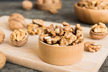 Fresh healthy walnuts in bowl on colored table background. Top view Healthy eating bertholletia concept. Super foods