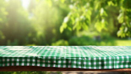 Sun-dappled garden backdrop with a close-up of a green and white checkered tablecloth spread neatly over a wooden table