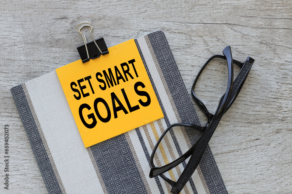 Poster set smart goals text on yellow paper for notes on a notepad