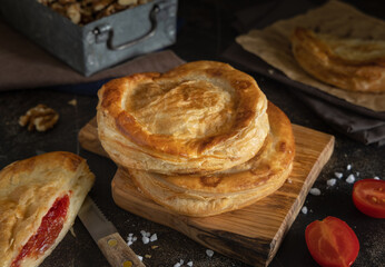 Rustico puff pastry from Lecce filled with stuffed with tomato, mozzarella and bechamel sauce