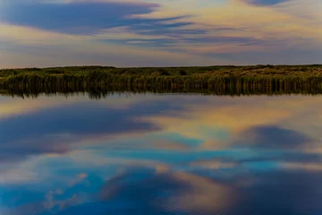 Foto op Canvas sunset over the river © Mikhail