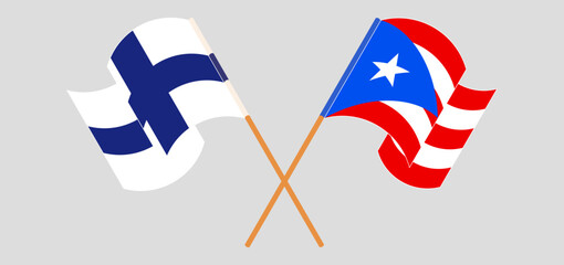 Crossed and waving flags of Finland and Puerto Rico