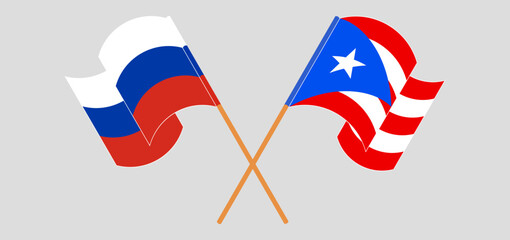 Crossed and waving flags of Russia and Puerto Rico