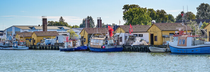 Panorama of the fishing port of Freest with traditional boats and typical yellow stalls at the...