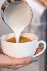 Barista coffee service concept.Barista women using coffee machine to make coffee in cafe