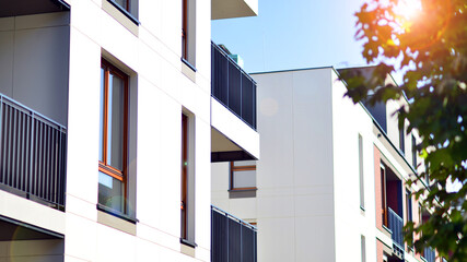 Brand new apartment building on sunny day. Modern residential architecture. Modern multi-family apartment house. 