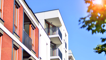 Brand new apartment building on sunny day. Modern residential architecture. Modern multi-family apartment house. 