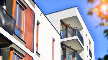 Fototapeta na wymiar Brand new apartment building on sunny day. Modern residential architecture. Modern multi-family apartment house. 