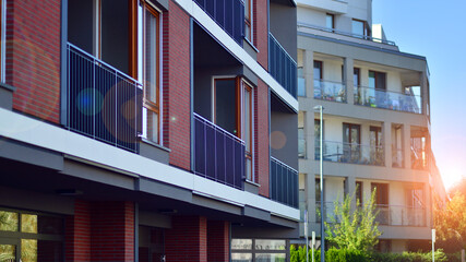 Brand new apartment building on sunny day. Modern residential architecture. Modern multi-family...
