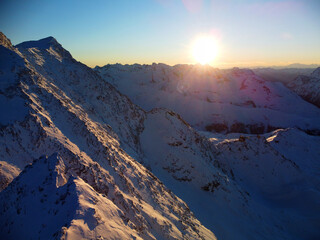 Snowy mountains on the ski area. Snowboarding and ski area. Tirol. Austria. Travel sunset concept
