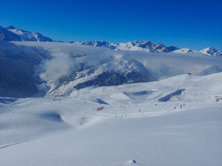 Snowy mountains in  sunny on the ski area. Snowboarding and ski area. Tirol. Austria. Travel concept