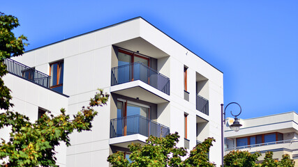 Fototapeta premium Green community. Eco apartment building saving energy and fresh air concept. Block of flats in beautiful green public