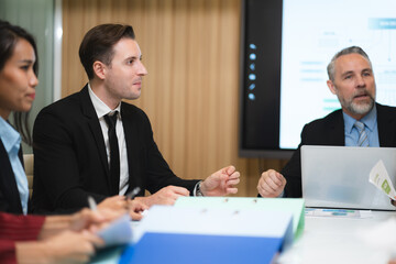 Business people, teamwork and meeting for strategy, planning or corporate brainstorming discussion at office. Group of employees in team collaboration or communication in conference at the workplace