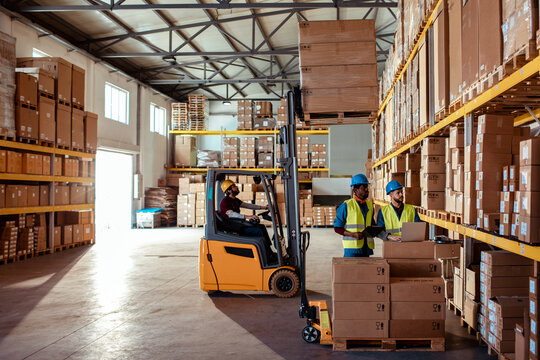 Wide angle view of diverse workers in a warehouse
