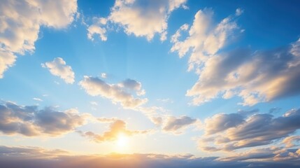 Fototapeta premium Blue sky clouds background Beautiful landscape with clouds and orange sun on sky 