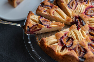 Autumn fruit cake with plums and apples