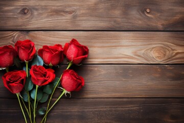 Bouquet of red roses on a wooden table with copy space. Wooden background. Top view, flat lay. Valentine's Day. Anniversary. Women's Day.